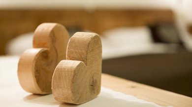 Two wooden hearts on a base, radiating loving craftsmanship and natural beauty.